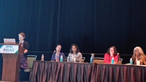 Dr Kathy Leadbitter presenting at an INSAR panel alongside Dr Gauri Divan and others.