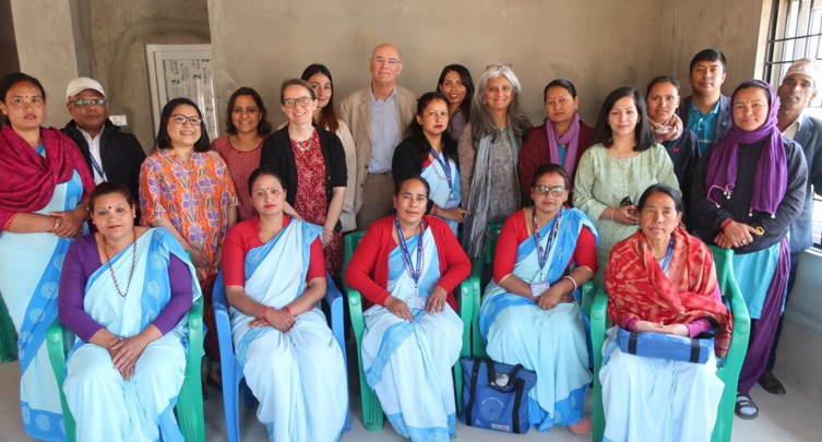Visiting NAMASTE team members with volunteers and officials in Nepal.